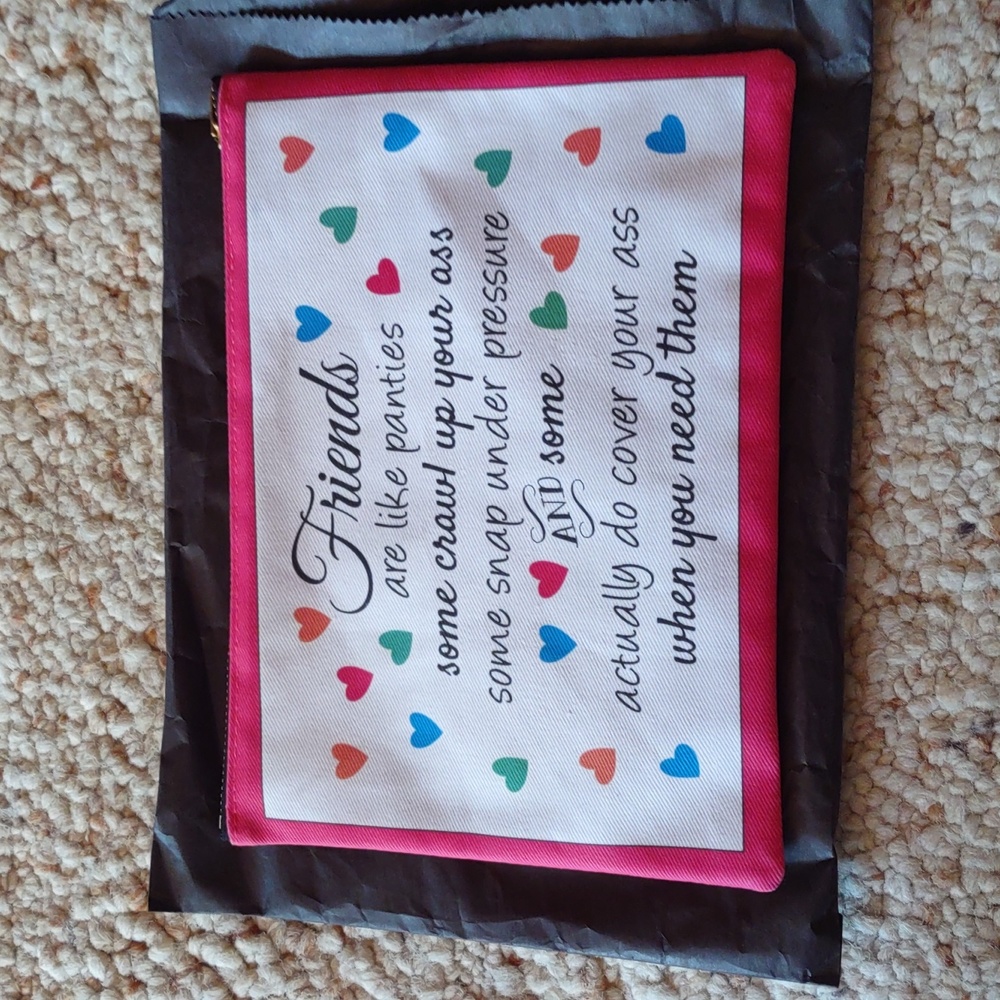 Small pouch brand new with zipper.